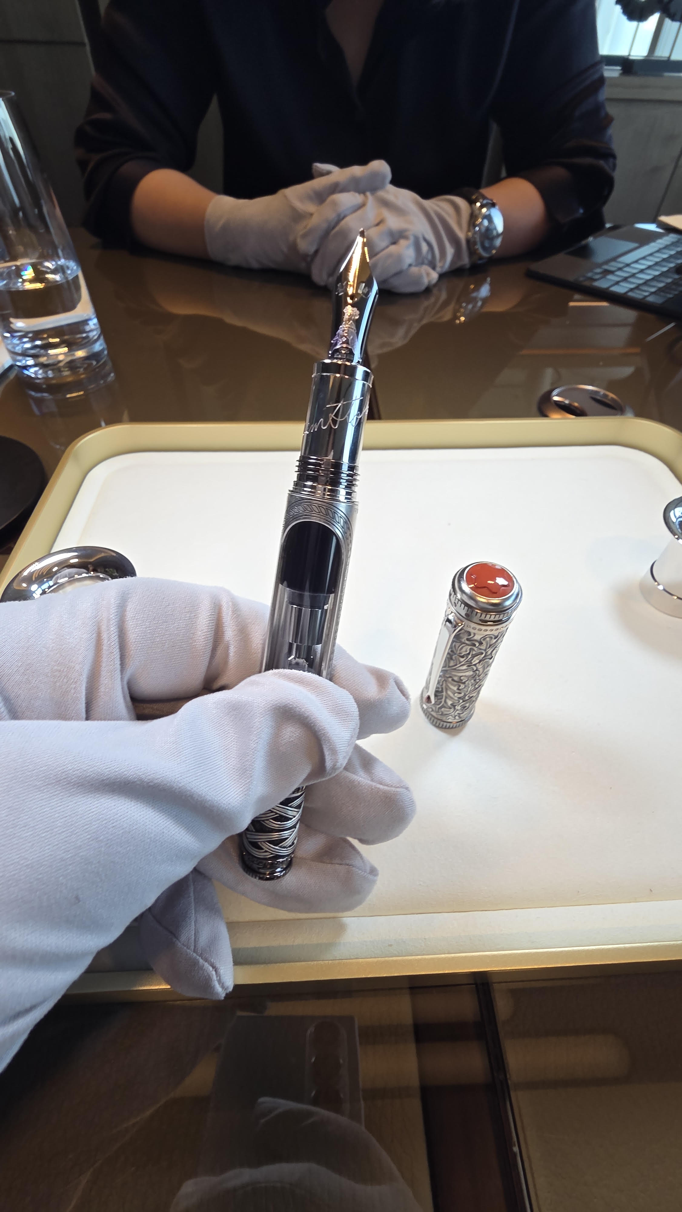 Intricate acanthus filigree and syringe-inspired barrel